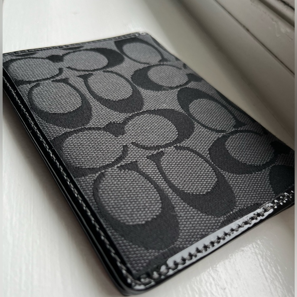 Coach Passport Holder Black Large C pattern with stitched detail around edges